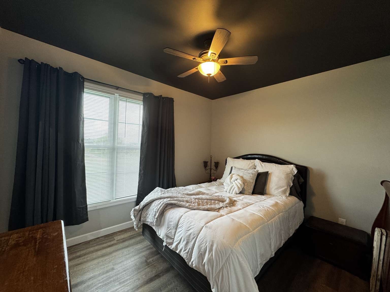 5056 Spencer Hale Road Morristown, TN 37813 - Photo 35 of 69 a bedroom with a bed and a chandelier