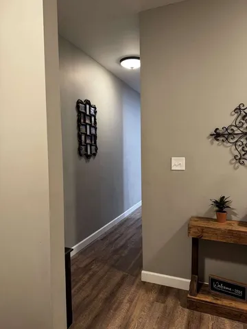 a kitchen with stainless steel appliances kitchen island granite countertop a table chairs stove and refrigerator