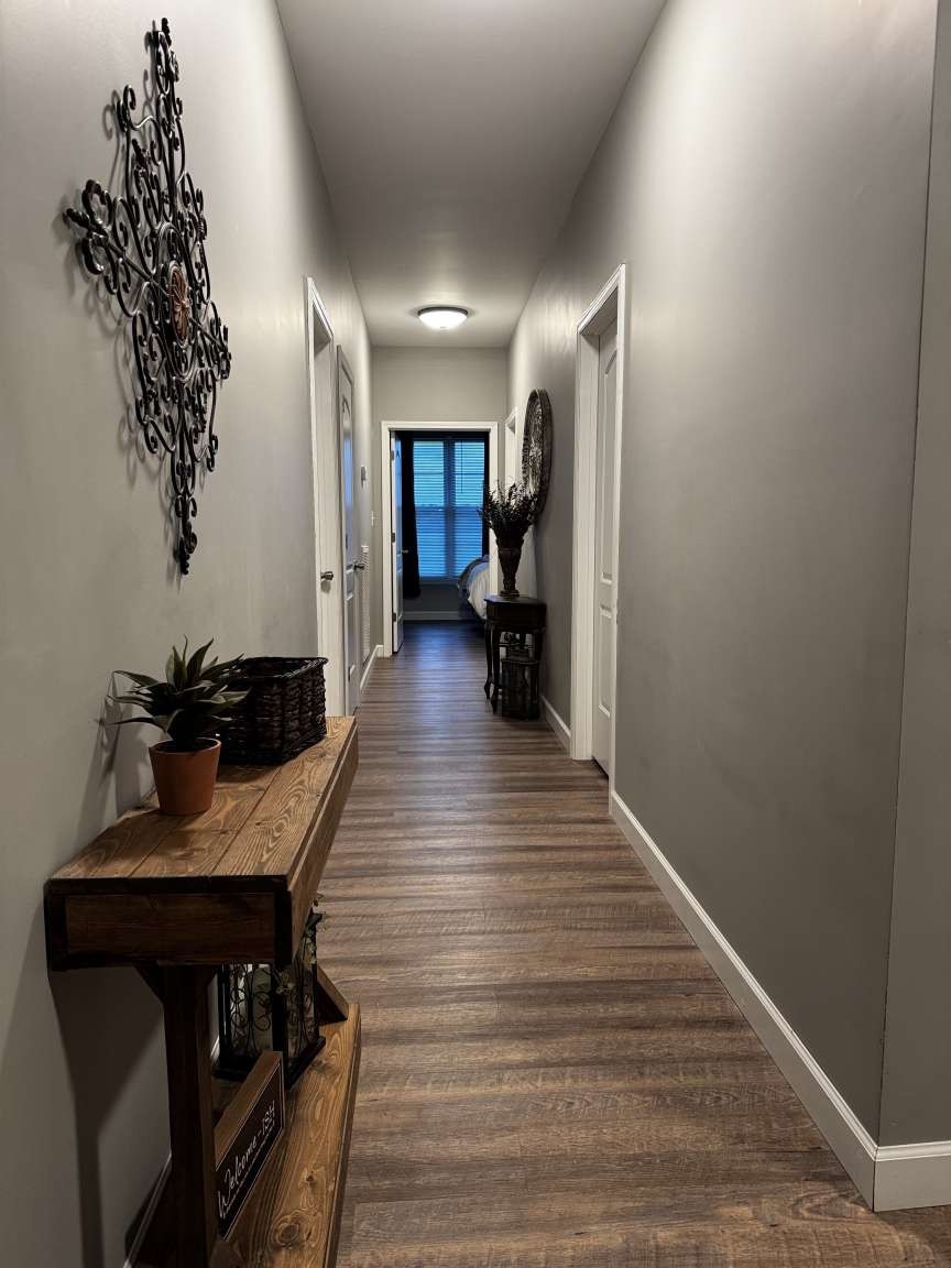5056 Spencer Hale Road Morristown, TN 37813 - Photo 8 of 70 a hallway with wooden floor furniture and a potted plant