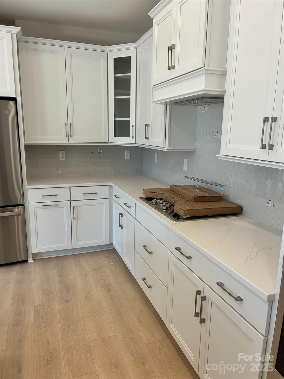 3027 Five Creek Road Charlotte, NC 28213 - Photo 5 of 17 a kitchen with granite countertop white cabinets and white appliances