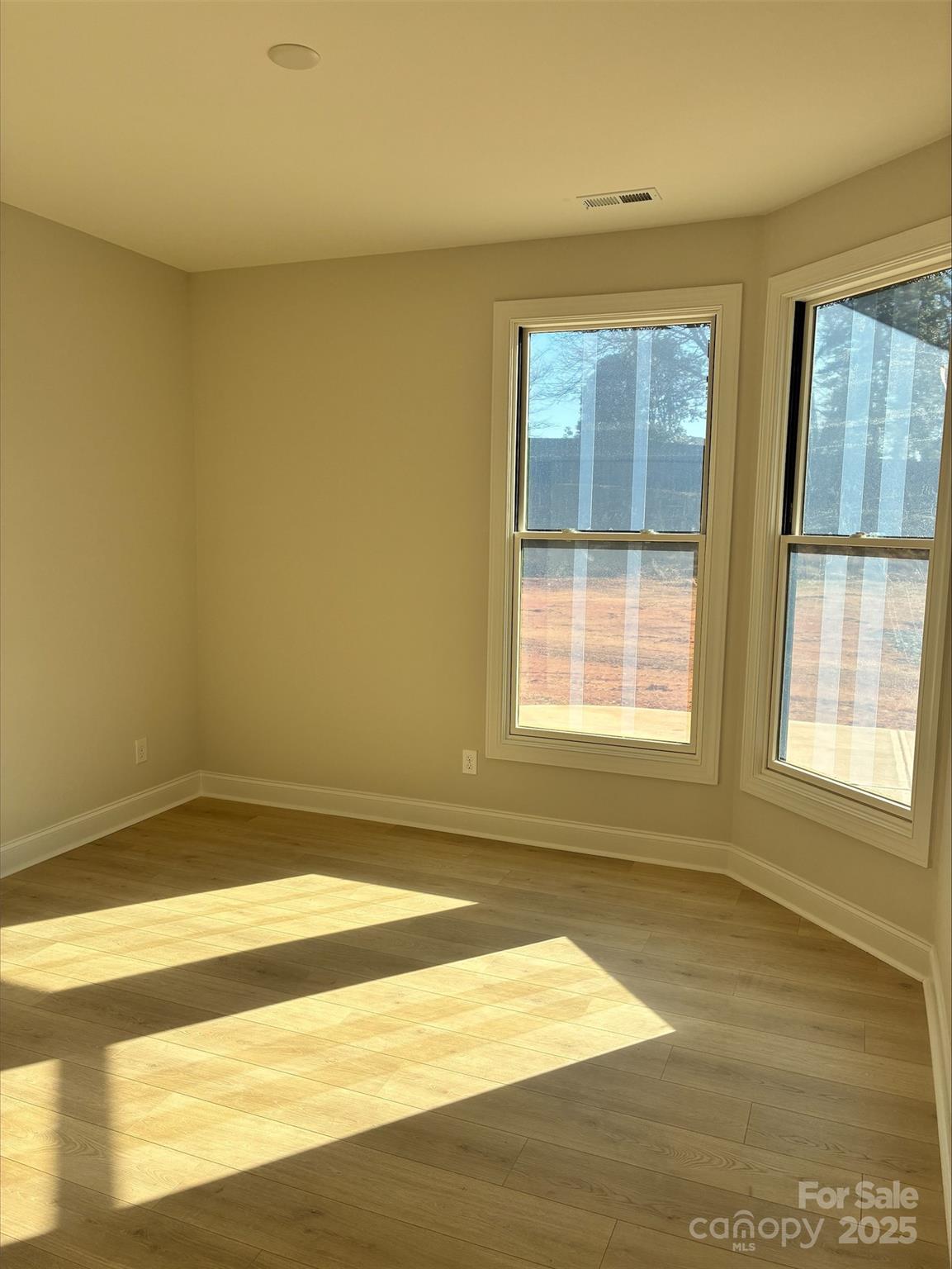 3027 Five Creek Road Charlotte, NC 28213 - Photo 8 of 17 a view of an empty room with a window