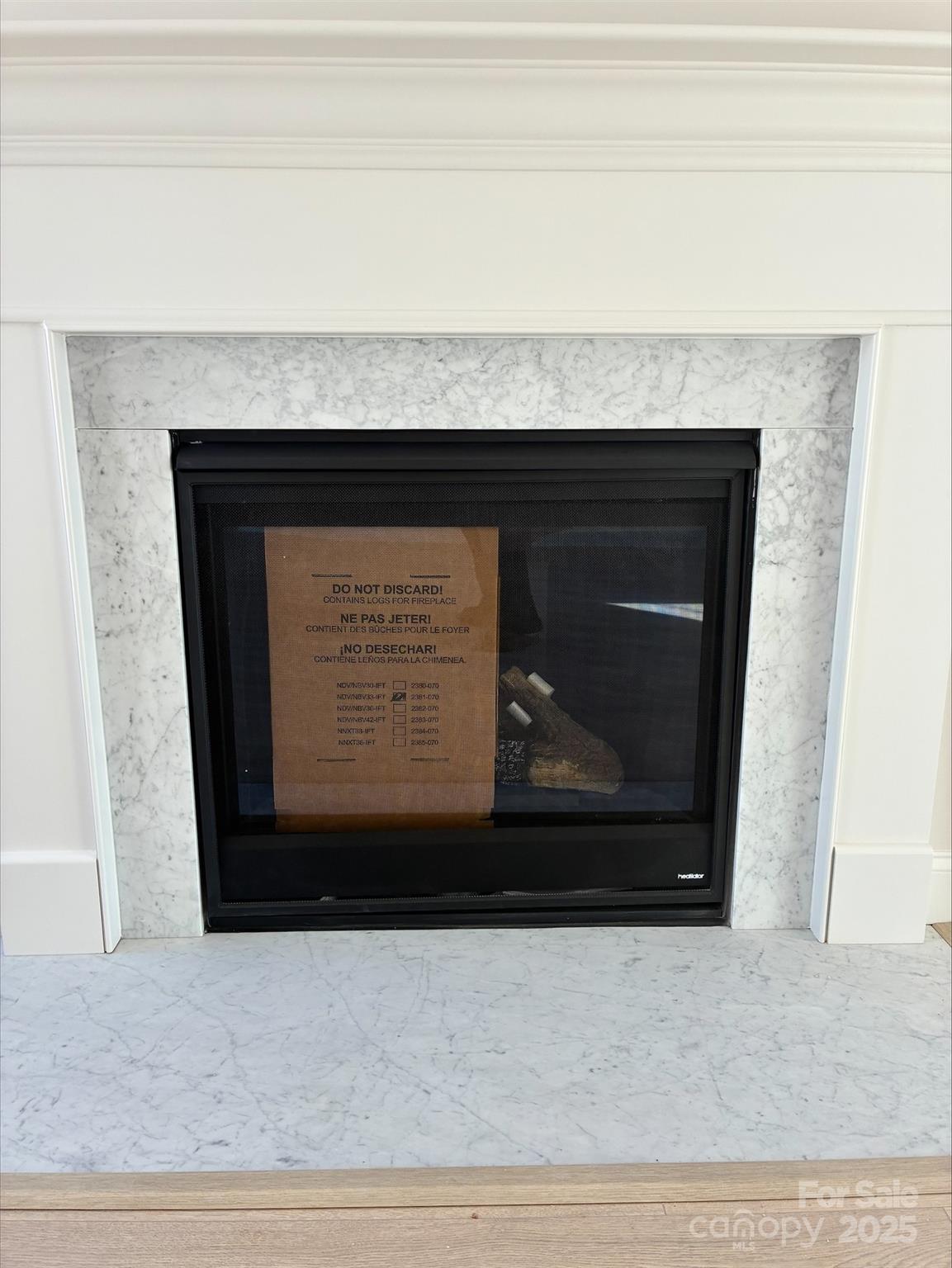 3027 Five Creek Road Charlotte, NC 28213 - Photo 10 of 17 a close view of fireplace with wooden floor