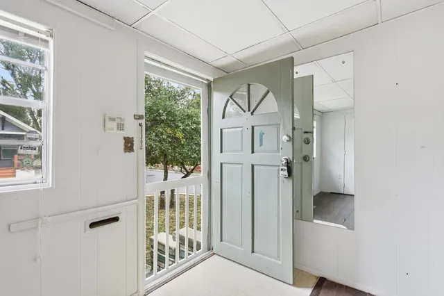 a view of a hallway with windows