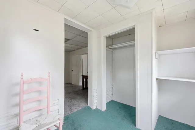 a view of a hallway with closet