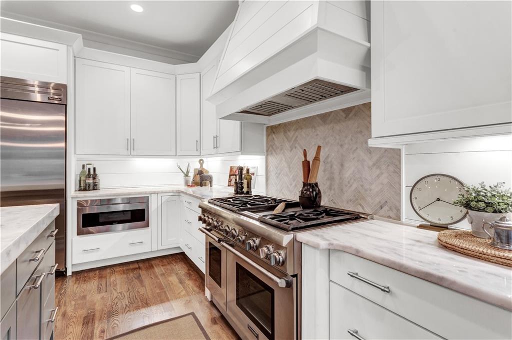 3081 Rhodenhaven Drive Northwest Atlanta, GA 30327 - Photo 14 of 57 a kitchen with granite countertop stainless steel appliances and cabinets