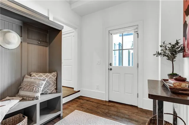 a living room with furniture a fireplace and a table