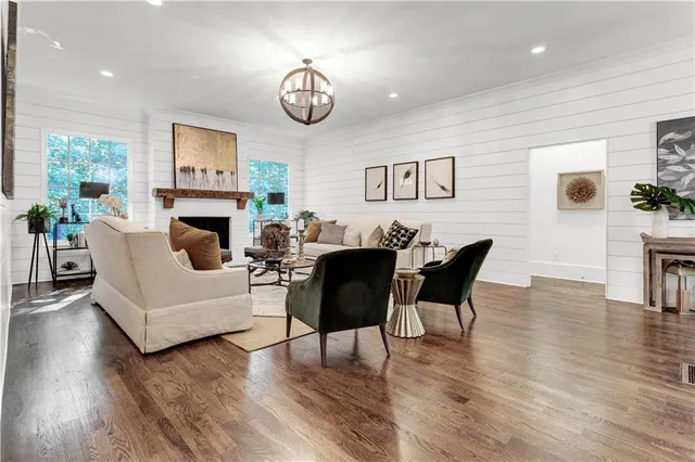 a dining room with furniture window and wooden floor