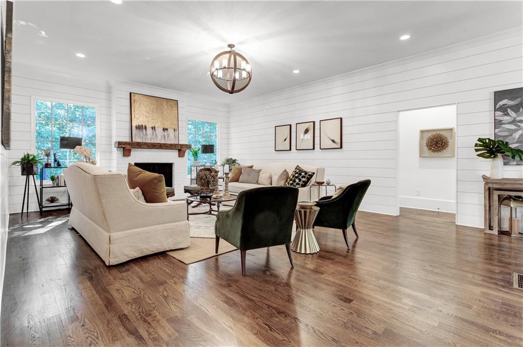 3081 Rhodenhaven Drive Northwest Atlanta, GA 30327 - Photo 20 of 57 a living room with furniture a fireplace and a table