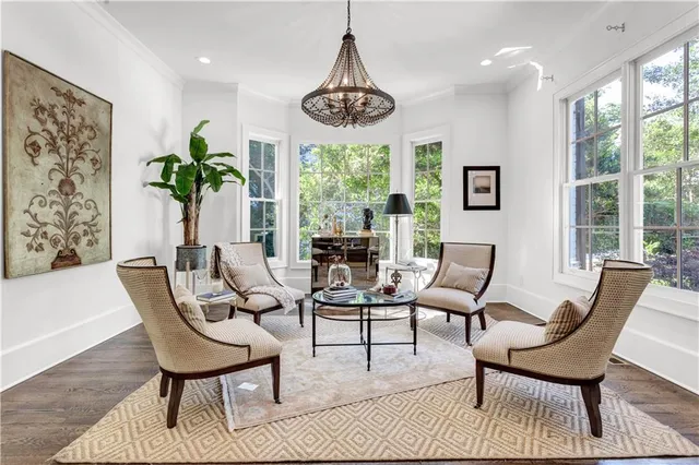a view of a dining room with furniture window and wooden floor
