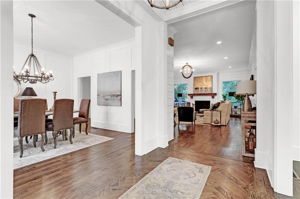 3081 Rhodenhaven Drive Northwest Atlanta, GA 30327 - Photo 26 of 57 a view of a dining room and livingroom with furniture wooden floor a chandelier
