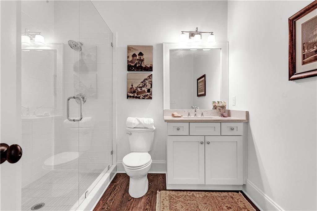 3081 Rhodenhaven Drive Northwest Atlanta, GA 30327 - Photo 29 of 57 a bathroom with a sink toilet and shower