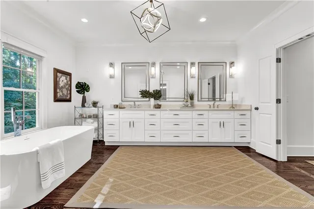 a large bedroom with a large bed and a window