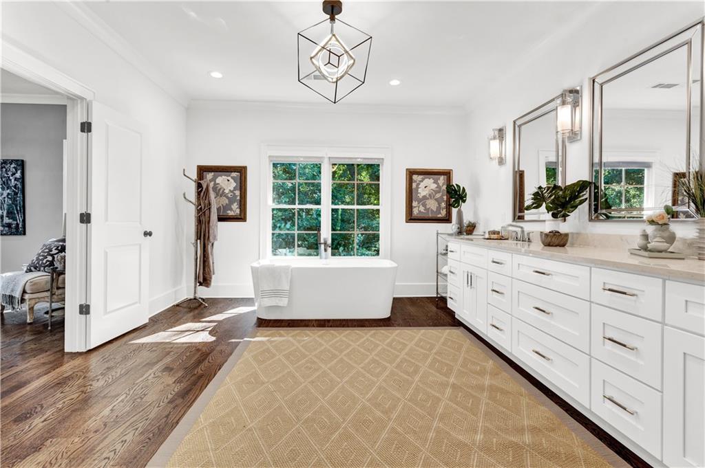 3081 Rhodenhaven Drive Northwest Atlanta, GA 30327 - Photo 37 of 57 a large bedroom with a large bed and a window