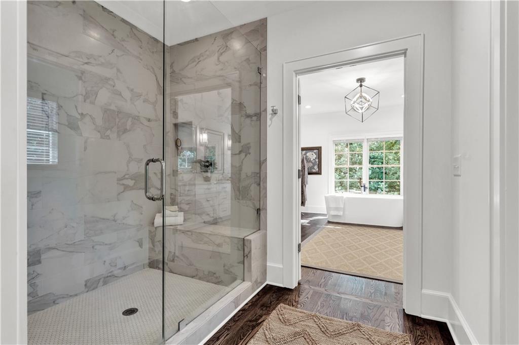 3081 Rhodenhaven Drive Northwest Atlanta, GA 30327 - Photo 40 of 57 a bathroom with a glass shower door