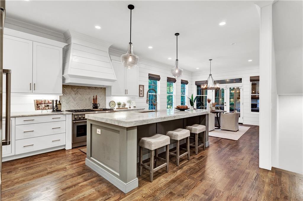 3081 Rhodenhaven Drive Northwest Atlanta, GA 30327 - Photo 4 of 57 a large kitchen with a table and chairs