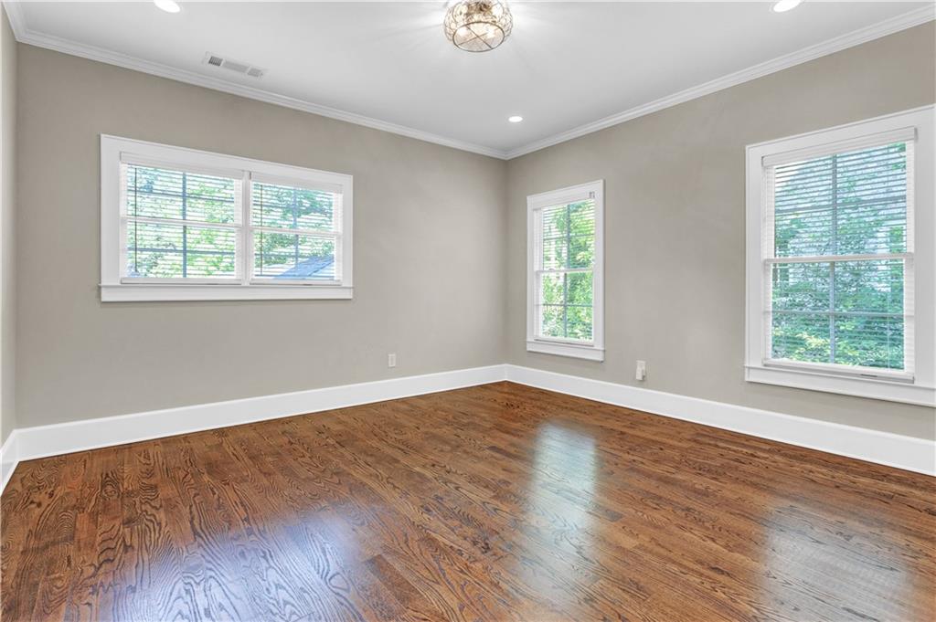 3081 Rhodenhaven Drive Northwest Atlanta, GA 30327 - Photo 46 of 57 a view of an empty room with wooden floor and a window