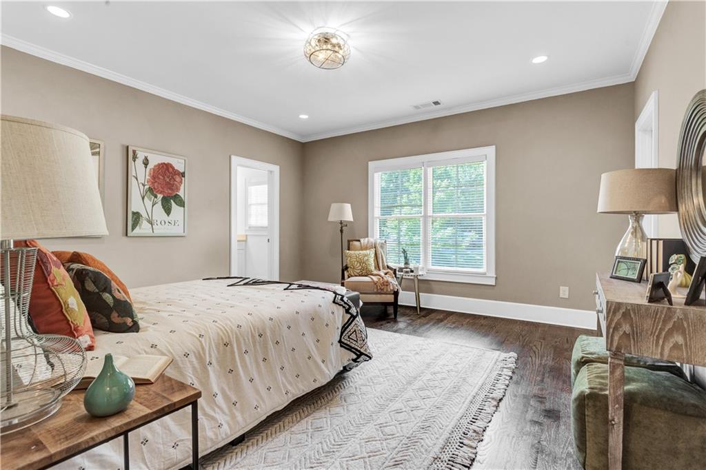 3081 Rhodenhaven Drive Northwest Atlanta, GA 30327 - Photo 48 of 57 a spacious bedroom with a bed a couch and a window