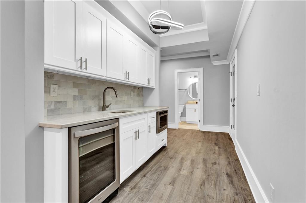 3081 Rhodenhaven Drive Northwest Atlanta, GA 30327 - Photo 53 of 57 a kitchen with granite countertop a sink and cabinets