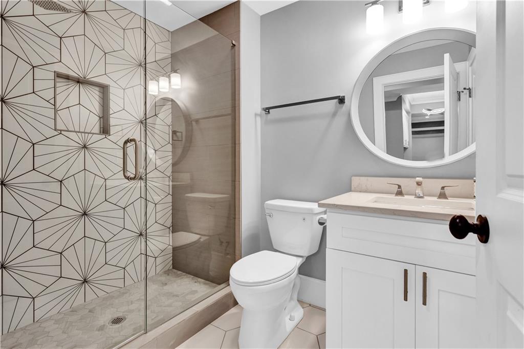 3081 Rhodenhaven Drive Northwest Atlanta, GA 30327 - Photo 55 of 57 a bathroom with a sink toilet and shower