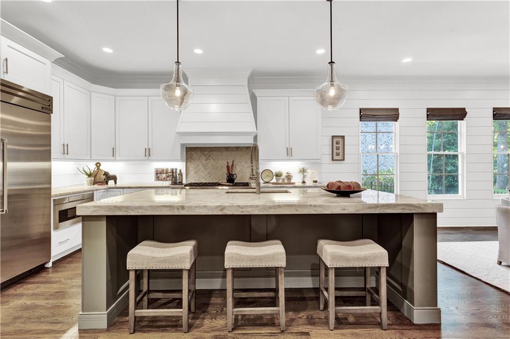 3081 Rhodenhaven Drive Northwest Atlanta, GA 30327 - Photo 6 of 57 a kitchen with granite countertop counter space a sink stainless steel appliances and cabinets