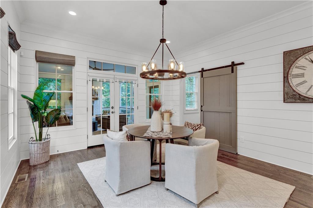 3081 Rhodenhaven Drive Northwest Atlanta, GA 30327 - Photo 10 of 57 a living room with furniture a chandelier and a table