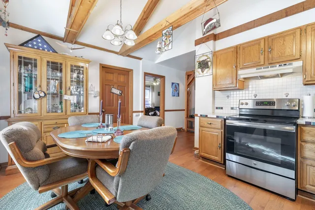 a view of a dining room with furniture window and outside view