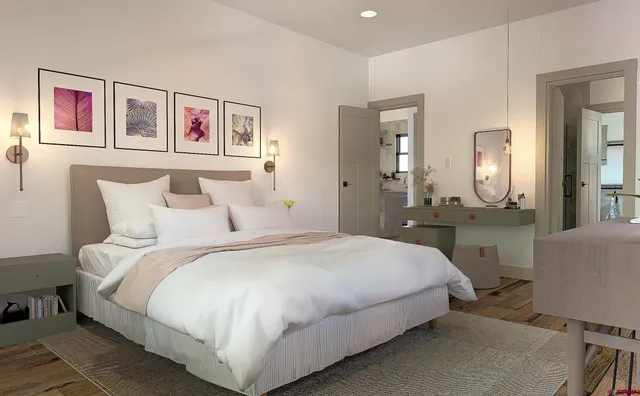 a bedroom with a bed and a mirror