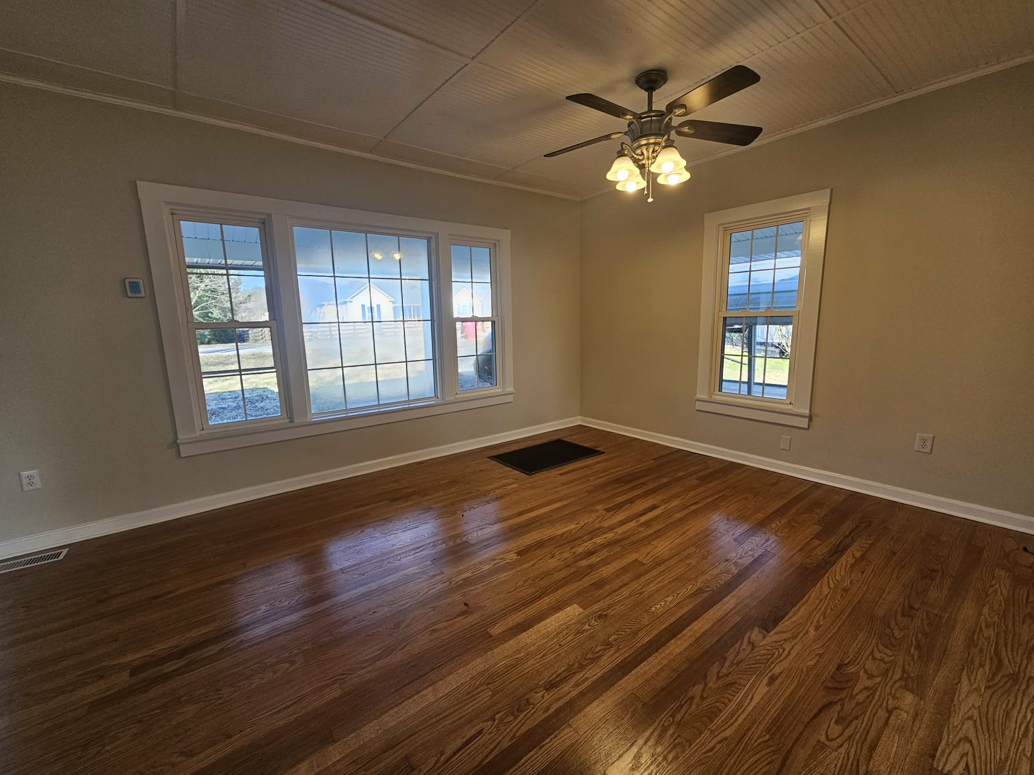 205 Fite Avenue West Carthage, TN 37030 - Photo 25 of 55 a view of an empty room with wooden floor and a window