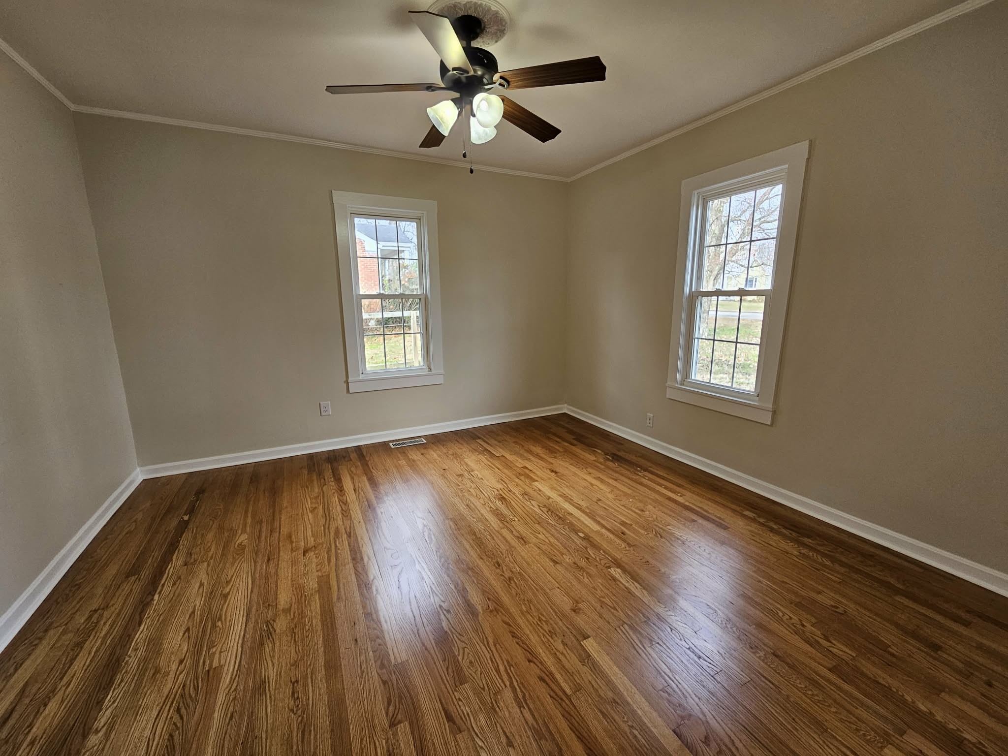 205 Fite Avenue West Carthage, TN 37030 - Photo 28 of 55 a view of an empty room with wooden floor and a window