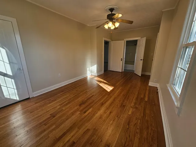 a kitchen with sink window and cabinets