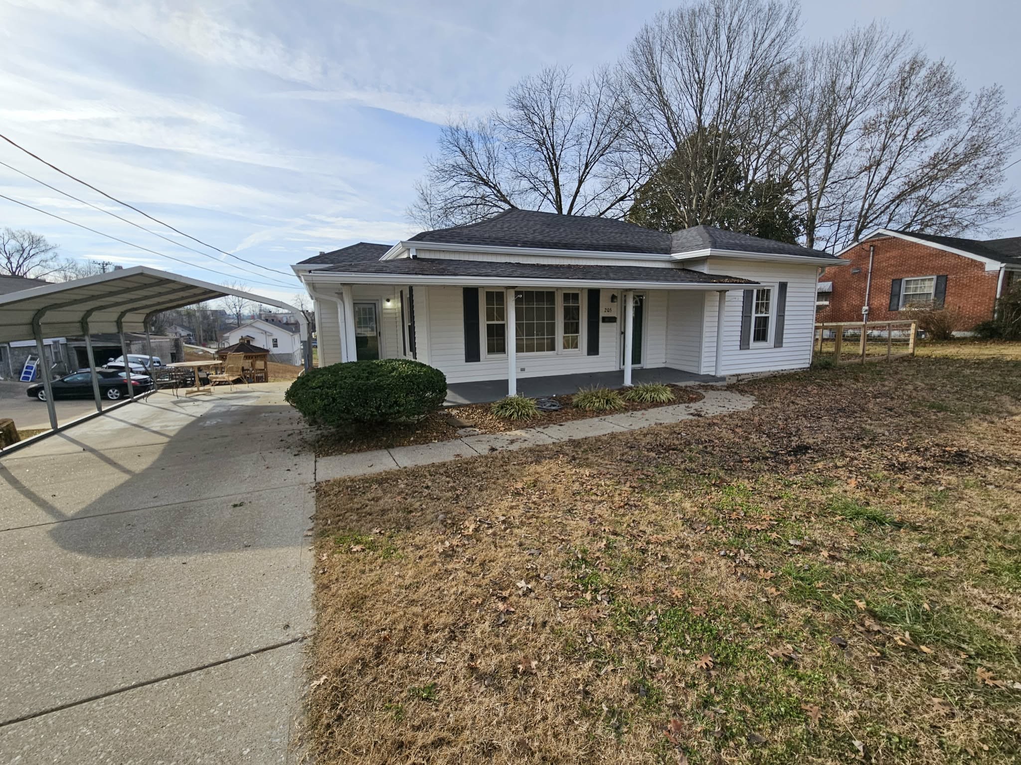 205 Fite Avenue West Carthage, TN 37030 - Photo 9 of 55 a front view of a house with a garden