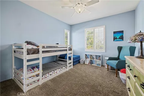 a bedroom with furniture and a bed