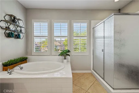 a bathroom with a tub and a shower
