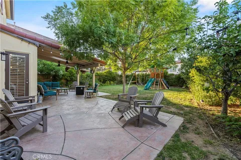 a view of a backyard with sitting area