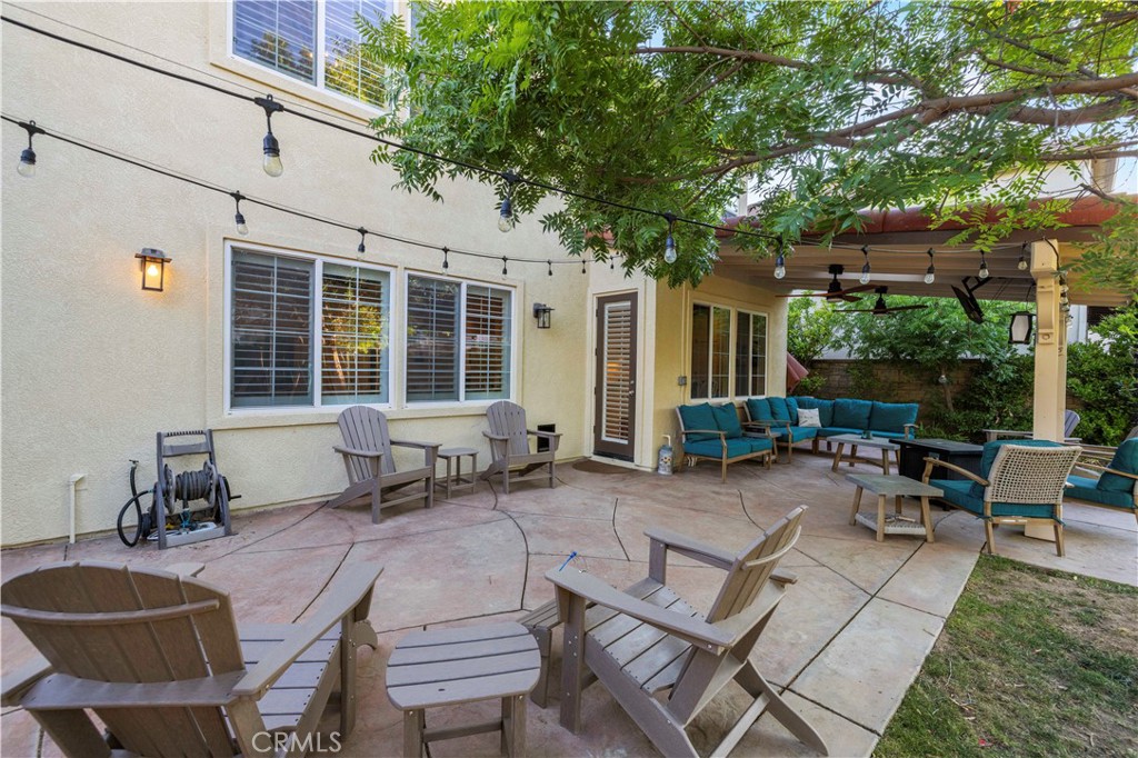 24303 Las Palmas Street Valencia, CA 91355 - Photo 26 of 34 a backyard of a house with outdoor seating