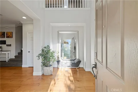 a view of a bedroom with a bed and glass door