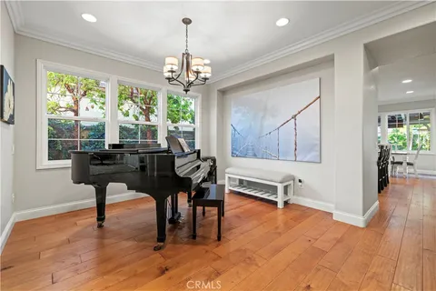 a view of a livingroom with furniture window and wooden floor