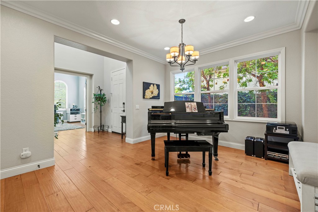 24303 Las Palmas Street Valencia, CA 91355 - Photo 5 of 34 a view of a dining room with furniture window and wooden floor