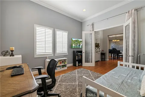 a bedroom with furniture and a window