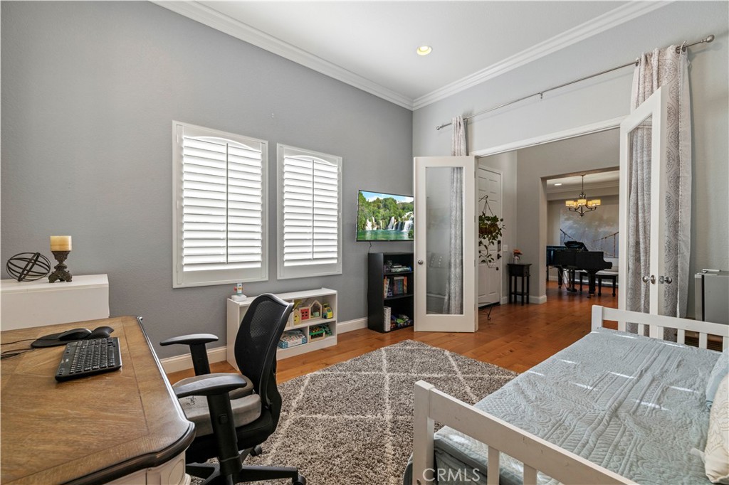 24303 Las Palmas Street Valencia, CA 91355 - Photo 6 of 34 a bedroom with furniture and a window