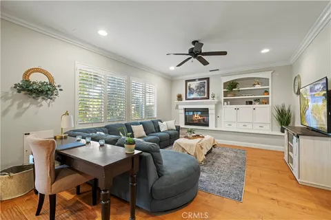 a living room with fireplace furniture and a flat screen tv