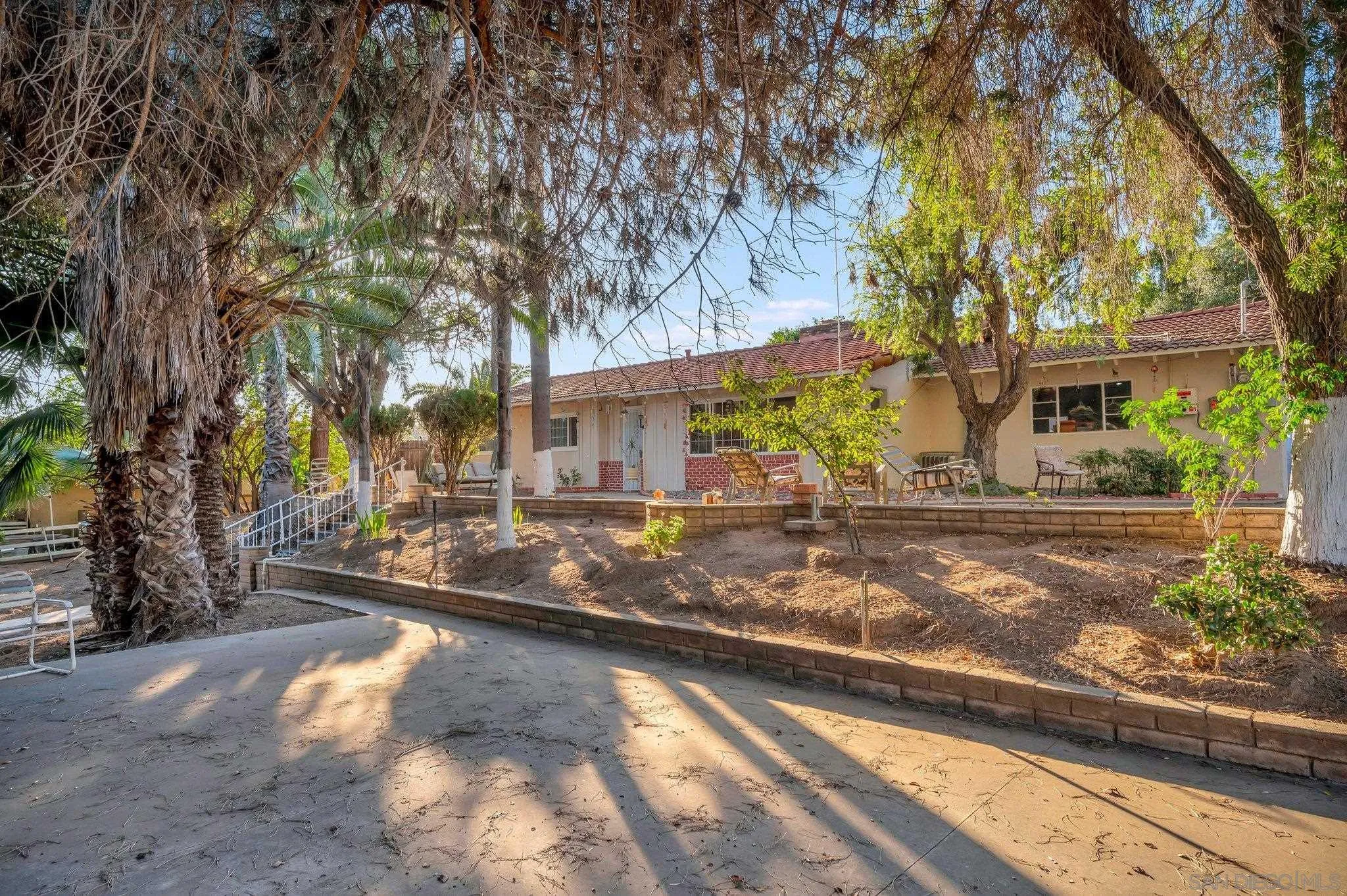 1886 Winrow Road El Cajon, CA 92021 - Photo 4 of 34 a view of a house with a yard