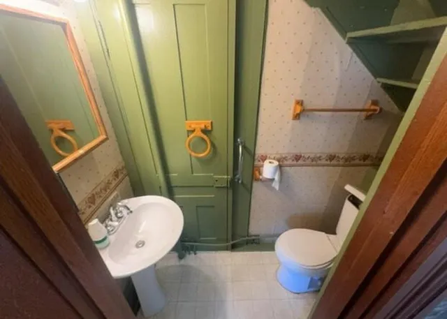 a bathroom with a sink and toilet