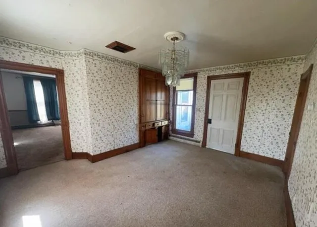 a view of a livingroom with a staircase