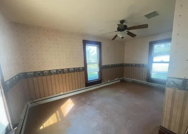 an empty room with windows