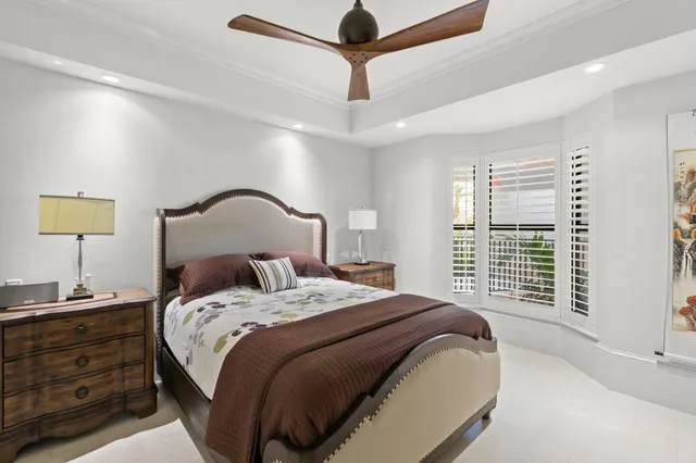 a living room with furniture a large window and a fireplace