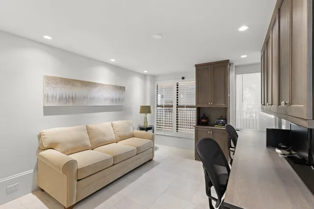 a kitchen with granite countertop white cabinets and a sink
