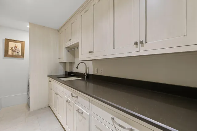 a view of a chairs and table in the balcony