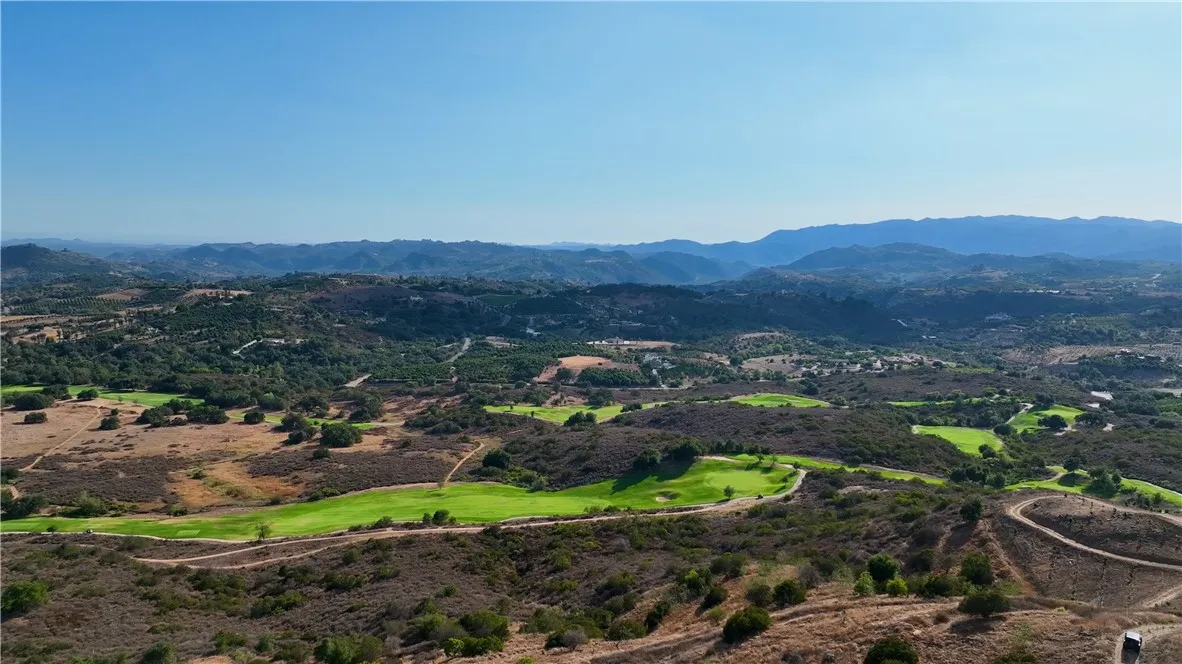 0 La Casita Temecula Ca Temecula, CA 92590 - Photo 8 of 9 a view of a lush green hillside and a houses