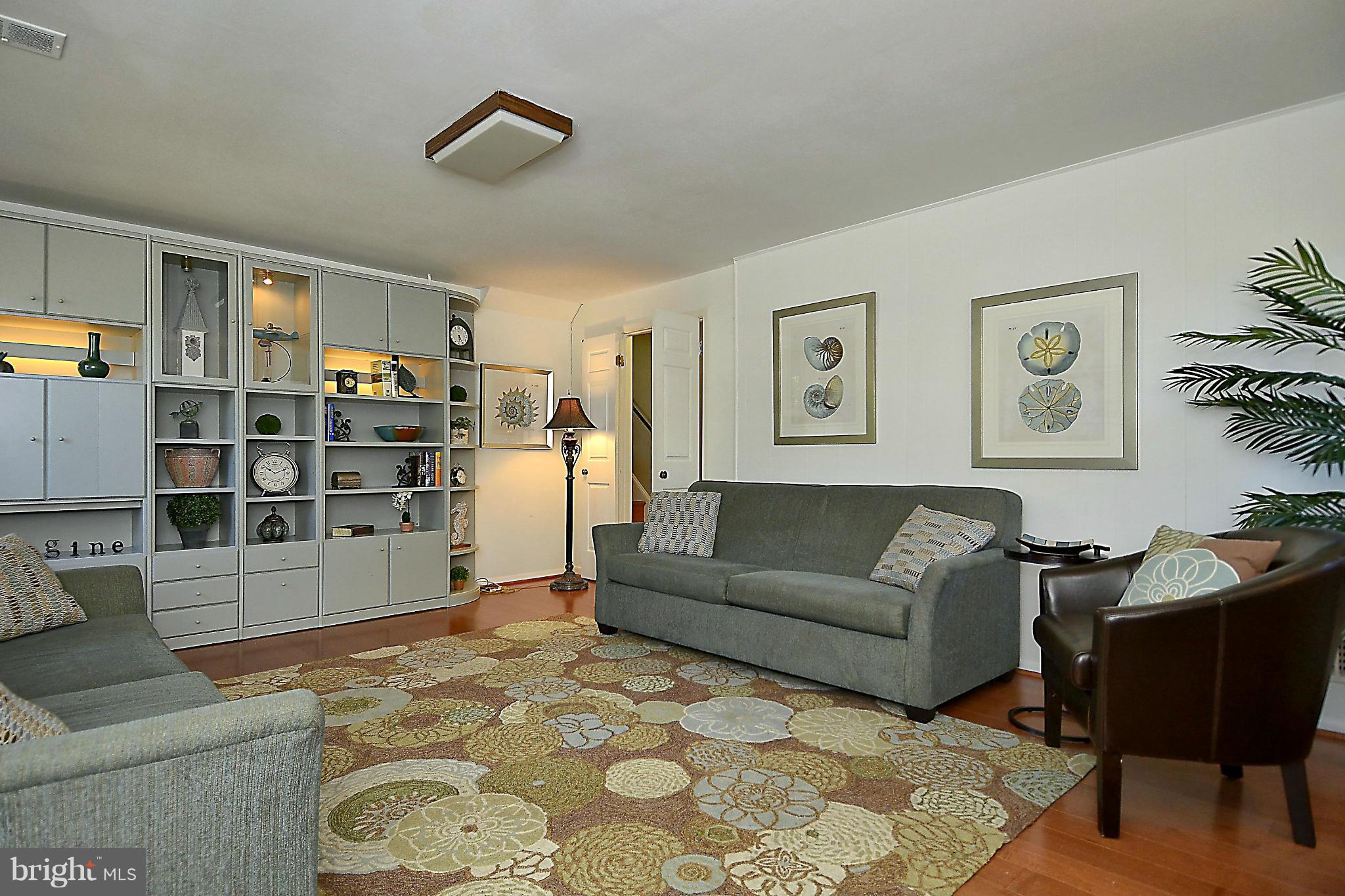 10104 Kohler Road Silver Spring, MD 20902 - Photo 15 of 30 FAMILY ROOM WITH MAPLE FLOORING AND WALL UNIT